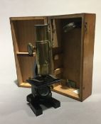 A cased student's microscope