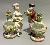 A pair of porcelain figurally mounted vases