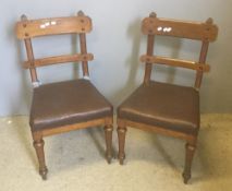 A pair of Victorian oak framed gothic side chairs