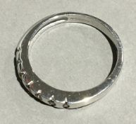 A 9 ct white gold half eternity ring set with seven diamonds