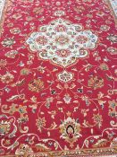 A red ground Kashan carpet 2.