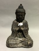 A large bronze praying Buddha