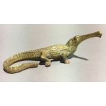 A brass model of a gharial