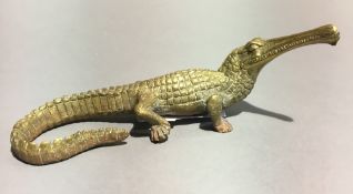 A brass model of a gharial