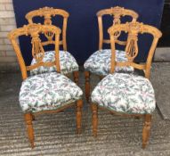 Four late 19th/early 20th century dining chairs with carved backs and tapestry seats