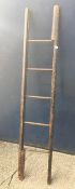 A 19th century stained pine library pole ladder