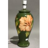 A Moorcroft Hibiscus pattern table lamp