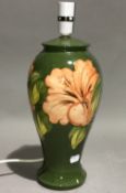 A Moorcroft Hibiscus pattern table lamp