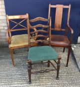 An Edwardian mahogany carved dining chair and two other chairs