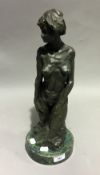 An abstract bronze figure of a nude girl