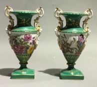 A pair of small green Sevres style vases