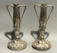 A pair of silver plated Art Nouveau vases,