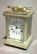 A silver plated miniature carriage clock