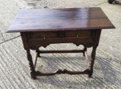 An 18th century style oak side table