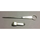 A silver cigar cutter and a silver plated meat skewer