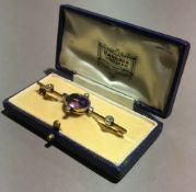 An antique amethyst and diamond bar brooch