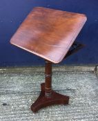 A Victorian mahogany tilt top reading table