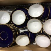 A French gilt heightened blue porcelain tea set