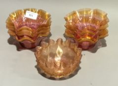 A set of gilt heightened cranberry glass bowls