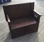 A Victorian oak monk's bench