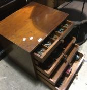 A chest of drawers containing Meccano