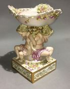 A cherub porcelain comport