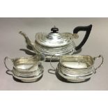 A three piece silver tea set