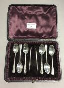 A set of cased silver teaspoons and tongs