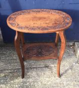 An early 20th century carved oak centre table