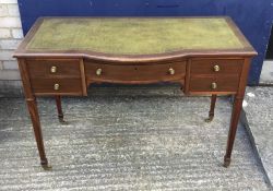 An Edwardian mahogany writing desk with green leather top