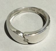 A 9 ct white gold single stone diamond band ring