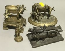 Four Indian metal figures,