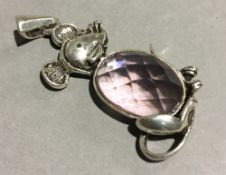 A silver mouse pendant