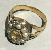 An antique topaz and pearl cluster ring