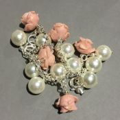 A silver coral and pearl bracelet