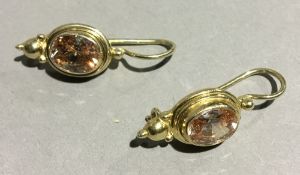 A pair of silver gilt stone set earrings