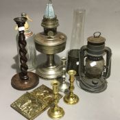 A vintage oil lamp, lantern, candlesticks, etc.