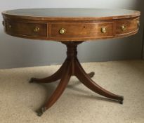 A Regency style mahogany drum table