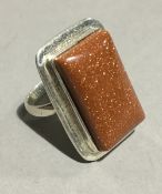 A silver and gold stone ring