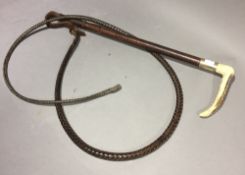 An antler handled leather riding crop