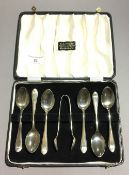 A set of cased silver teaspoons and tongs