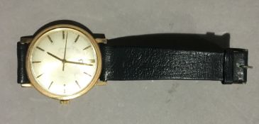 A gold gentlemen's Omega wristwatch