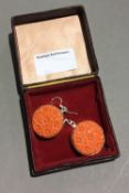 A pair of chrysanthemum and silver earrings