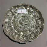 An embossed unmarked Eastern silver dish (approx 3.