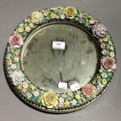 A 19th century floral porcelain mirror