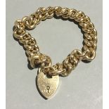 An Edwardian 15 ct rose gold bracelet, with heart shaped locket (approximately 28.