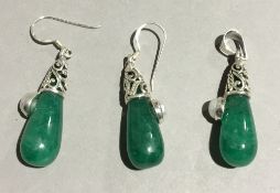 A jade and pearl earrings and pendant set