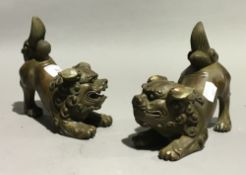 A pair of bronze dogs-of-fo