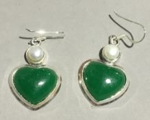 A pair of silver and jade heart shaped earrings