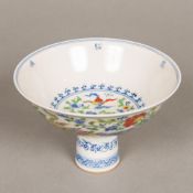 A Chinese Wucai porcelain stem bowl Worked with exotic birds amongst floral sprays,